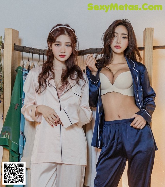 two women in pajamas standing next to each other